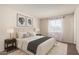 Serene bedroom showcasing a plush bed, neutral decor, and soft natural light, creating a relaxing retreat at 3408 N 69Th Dr, Phoenix, AZ 85033