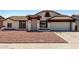 Charming home featuring a well-maintained exterior with a two-car garage and low-maintenance landscaping at 3408 N 69Th Dr, Phoenix, AZ 85033