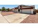 Charming home featuring a well-maintained exterior with a two-car garage and low-maintenance landscaping at 3408 N 69Th Dr, Phoenix, AZ 85033