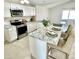 Bright kitchen with white cabinets, stainless steel appliances, and granite countertops offers style and functionality at 3408 N 69Th Dr, Phoenix, AZ 85033