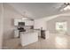 Modern kitchen boasting sleek white cabinetry, stainless steel appliances, and granite countertops at 3408 N 69Th Dr, Phoenix, AZ 85033