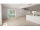 Bright living area offering tile flooring and an open layout, adjacent to the kitchen and sliding glass door at 3408 N 69Th Dr, Phoenix, AZ 85033