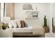 Cozy bedroom with a comfortable bed, stylish decorative pillows, and minimalist decor creating a relaxing retreat at 36550 W Maddaloni Ave, Maricopa, AZ 85138