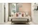 Serene bedroom featuring neutral tones, layered bedding, and decorative lamps creating a peaceful ambiance at 36550 W Maddaloni Ave, Maricopa, AZ 85138