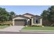 Charming single-story home with a neutral color palette, well-maintained lawn and desert landscaping at 36550 W Maddaloni Ave, Maricopa, AZ 85138