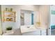 Well-lit bathroom with white vanity, a large mirror, and contemporary fixtures at 36600 W Maddaloni Ave, Maricopa, AZ 85138