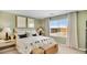 Cozy bedroom with neutral decor, comfortable bedding, and a bright window showcasing natural light at 36600 W Maddaloni Ave, Maricopa, AZ 85138