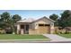 Charming single-story home with a two-car garage, well-maintained lawn, and inviting curb appeal at 36600 W Maddaloni Ave, Maricopa, AZ 85138