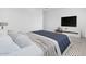 Neutral Bedroom featuring a cozy bed, tv and carpet flooring at 37695 W Santa Maria St, Maricopa, AZ 85138