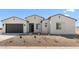 Charming single-story home with a gravel front yard, desert landscaping, and a two-car garage at 37695 W Santa Maria St, Maricopa, AZ 85138