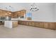Bright kitchen featuring wooden cabinets, stainless steel appliances, and an island with a sink at 37695 W Santa Maria St, Maricopa, AZ 85138