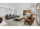 Spacious open-concept living room showcasing contemporary design with adjacent kitchen and comfortable seating at 37695 W Santa Maria St, Maricopa, AZ 85138