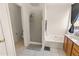 Bright bathroom includes a tub, shower stall, tiled flooring, and a vanity with natural wood finish at 3871 W Linda Ln, Chandler, AZ 85226
