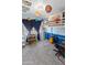 Small room with blue walls has a full sized bed and small desk with carpet floors at 3871 W Linda Ln, Chandler, AZ 85226