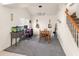 Multi-purpose bonus room with desk, dining set, and stairway at 3871 W Linda Ln, Chandler, AZ 85226