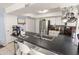 Well-equipped kitchen with stainless steel appliances, sleek countertops, and breakfast bar at 3871 W Linda Ln, Chandler, AZ 85226