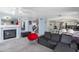 Spacious living room with a fireplace and adjacent modern kitchen space at 3871 W Linda Ln, Chandler, AZ 85226