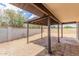 Spacious backyard patio area with decorative rock cover and shade structure is perfect for relaxing outdoors at 4226 W Evans Dr, Phoenix, AZ 85053