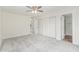 New carpet in the bedroom with a ceiling fan, large window, and a closet at 4226 W Evans Dr, Phoenix, AZ 85053