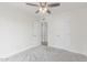 This bright bedroom features neutral walls, soft carpet, and a walk-in closet at 4226 W Evans Dr, Phoenix, AZ 85053