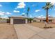 A charming single-story home with a wide driveway, showcasing a well-kept exterior and a two-car garage at 4226 W Evans Dr, Phoenix, AZ 85053