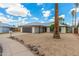 A lovely single-story home, featuring a wide driveway, with a two-car garage and xeriscaped front yard at 4226 W Evans Dr, Phoenix, AZ 85053