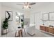 This home office features a ceiling fan, neutral walls, and backyard-view windows at 4226 W Evans Dr, Phoenix, AZ 85053