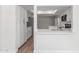 Bright kitchen features stainless appliances, wood floors, and modern white cabinets at 4226 W Evans Dr, Phoenix, AZ 85053