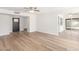 Spacious living area with wood-look floors, offering a versatile layout and seamless flow to other rooms at 4226 W Evans Dr, Phoenix, AZ 85053