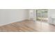 Bright, open room with wood-look floors and sliding doors for indoor-outdoor living and lots of light at 4226 W Evans Dr, Phoenix, AZ 85053