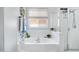 Relaxing bathroom featuring a large soaking tub with a window and a separate glass-enclosed shower at 4231 E Augusta Ave, Chandler, AZ 85249