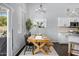Bright dining room with wooden table, ample seating, and stylish chandelier with decor at 4231 E Augusta Ave, Chandler, AZ 85249