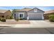 Charming single-story home with a well-manicured yard and a two-car garage at 4231 E Augusta Ave, Chandler, AZ 85249