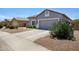 A single-story house featuring a two-car garage and desert landscaping at 4231 E Augusta Ave, Chandler, AZ 85249