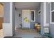 Inviting front porch with decorative pillows, flower pot, and door decoration at 4231 E Augusta Ave, Chandler, AZ 85249