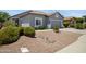 Single-story home with a two-car garage and gravel landscaping at 4231 E Augusta Ave, Chandler, AZ 85249
