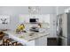 Open concept kitchen with granite island and stainless steel appliances at 4231 E Augusta Ave, Chandler, AZ 85249