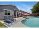 Resort-style pool area with lounge chairs, a built-in spa, and a spacious patio for outdoor enjoyment at 4231 E Augusta Ave, Chandler, AZ 85249