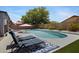 Inviting pool area with comfortable lounge chairs and bright pink umbrellas that offer a relaxing outdoor oasis at 4231 E Augusta Ave, Chandler, AZ 85249