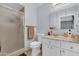 Cozy bathroom featuring a glass shower, toilet, and vanity with storage space and neutral tones at 4363 E Dragoon Cir, Mesa, AZ 85206