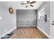 Large empty room with gray walls, hard wood flooring, base trim, and window at 4363 E Dragoon Cir, Mesa, AZ 85206