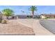 Inviting single-story home with desert landscaping and a spacious driveway, perfect for families at 4363 E Dragoon Cir, Mesa, AZ 85206