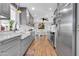 Modern kitchen with stainless steel appliances, farmhouse sink, and gray cabinetry at 4363 E Dragoon Cir, Mesa, AZ 85206