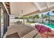 Lush backyard featuring a covered patio, sparkling pool, and a playset for outdoor fun at 4601 E Carolina Dr, Phoenix, AZ 85032