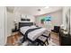 Bright bedroom with a tufted headboard, a faux fur rug, and modern accents offers a cozy and inviting space at 4601 E Carolina Dr, Phoenix, AZ 85032