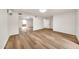 Bright bedroom with wood-look floors and mirrored closet doors at 4601 E Carolina Dr, Phoenix, AZ 85032