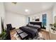 Modern bedroom featuring a plush bed, light wood floors, and stylish decor, creating a luxurious and comfortable ambiance at 4601 E Carolina Dr, Phoenix, AZ 85032