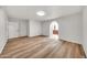 Bedroom featuring wood floors and an open entry into an ensuite bathroom at 4601 E Carolina Dr, Phoenix, AZ 85032