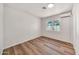 Bedroom featuring wood-look floors and natural light at 4601 E Carolina Dr, Phoenix, AZ 85032