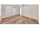 Bright bedroom featuring wood-look floors and natural light at 4601 E Carolina Dr, Phoenix, AZ 85032